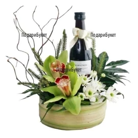 Stylish arrangement with orchids and wine