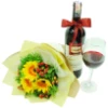 Order online a bouquet of gerberas and a bottle of wine with a ribbon