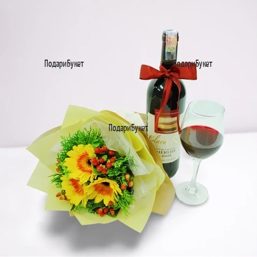 Order online a bouquet of gerberas and a bottle of wine with a ribbon