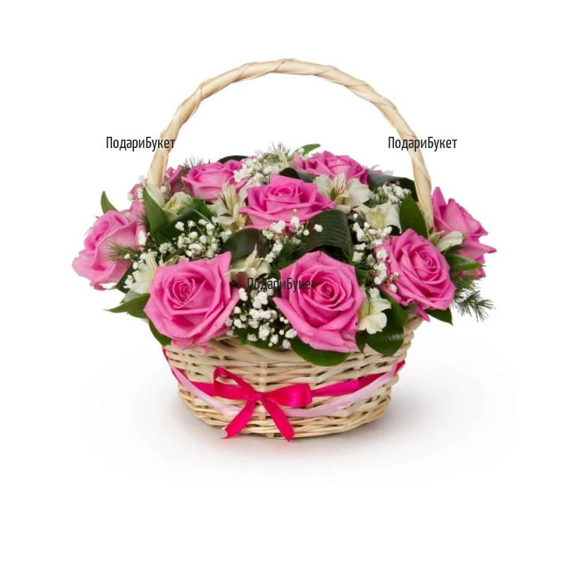 A basket with pink roses and greenery
