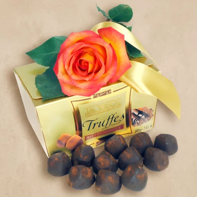 An orange rose and a box of truffles for a thoughtful romantic gesture. Choose the rose colour and add a card with your personal message inside.