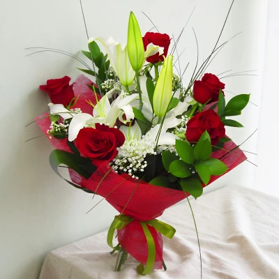 Passionate, elegant, classic bouquet for your loved one! Wonderful arrangement of brilliant roses, loving lilies and white gypsophila.